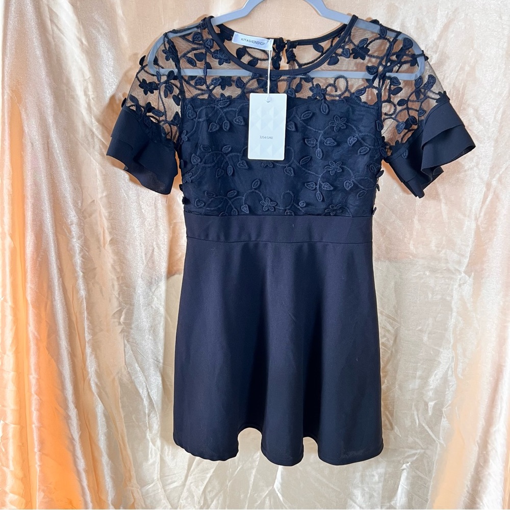 Black fit and flare floral appliqué lace top dress with butterfly sleeve accents